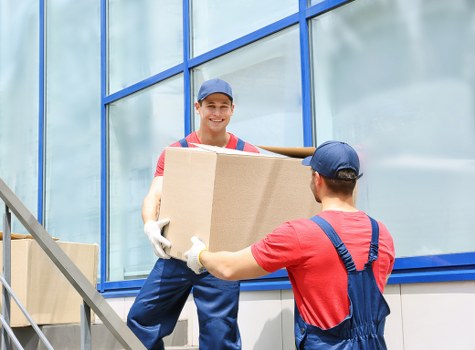 Local moving team organising boxes for a central London property in Brompton