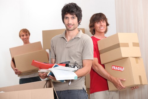 Crew handling boxed items with care during relocation