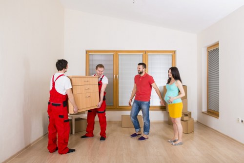 Employee and moving equipment symbolising ethical removal company operations