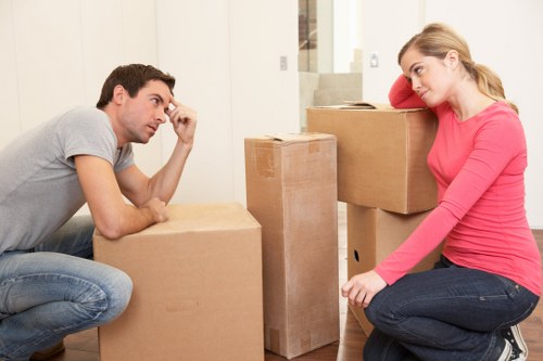 Packed moving boxes and protective wrapping ready for a house move in Brompton