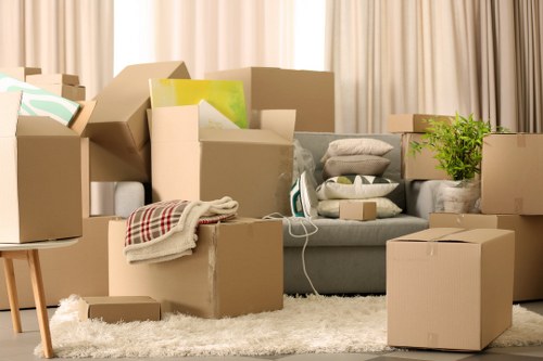 Moving crew wearing PPE while handling furniture safely