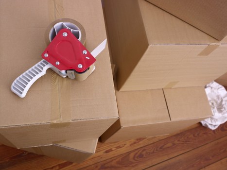 Packed boxes and wrapped furniture ready for transport in Brompton