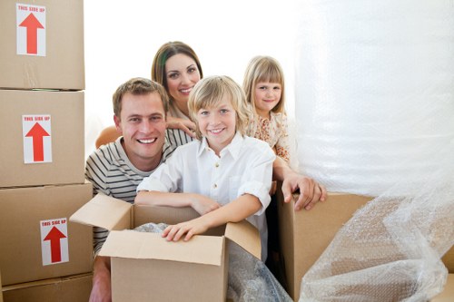 Careful packing of fragile household items for a move in Brompton