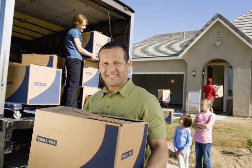 Packed boxes and furniture prepared for removals in Brompton