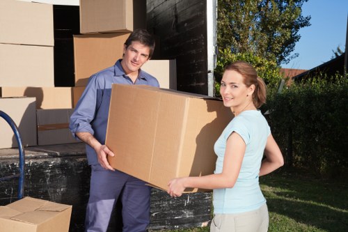Local moving team handling furniture in Brompton