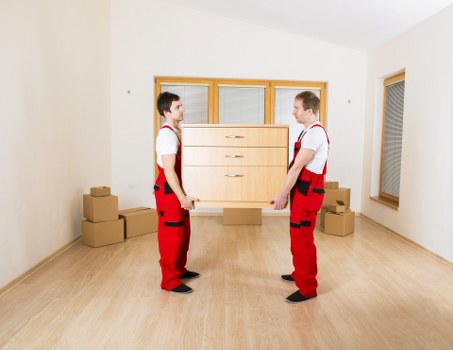 Local moving team handling boxes and furniture in Brompton