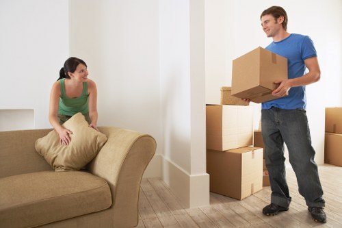 Trained removals staff managing fragile items during a Brompton move